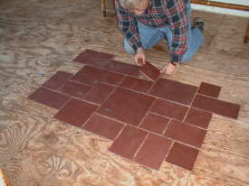 Slate is a great flooring material and is not too hard to install. You must first  layout the pieces to see how the pattern repeats.