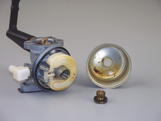 Gum and varnish build-up inside a small engine carburator will eventually lead to problems. Photo Credit: Briggs & Stratton.