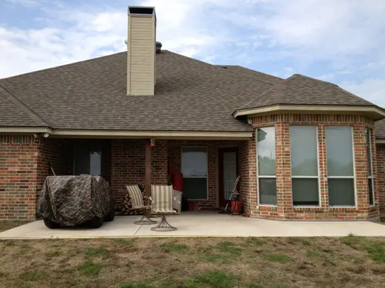 This patio will be extremely difficult to enclose. The irregular shape of the house and different roof heights create significant challenges. Photo Credit: Barry Hoosing