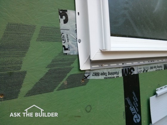 See the white tape that says Flashing Tape? It’s installed incorrectly. Photo Credit: Tim Carter