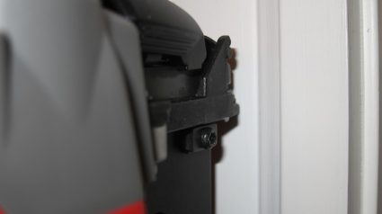 Here is the Milwaukee 18-gauge brad nailer. You can't even see the target. It's somewhere under all that metal that forms the nose of the gun. The tool was aligned exactly as the Paslode gun was in the above photo. You have no idea if the nail will go where you want it to go. Photo credit: Tim Carter
