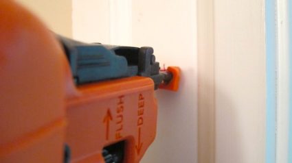 This is the gold standard brad nailer in my opinion. It's the Paslode 18-gauge brand nailer. Had I pulled the trigger the nail would absolutely hit the center of the target. You can see the horizontal red line and the top half of the vertical line. The orange protective nosing on the tool has sight lines you line up so the nail goes exactly where you want it. Photo credit: Tim Carter