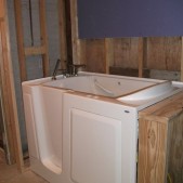 Walk in bathroom tub being installed