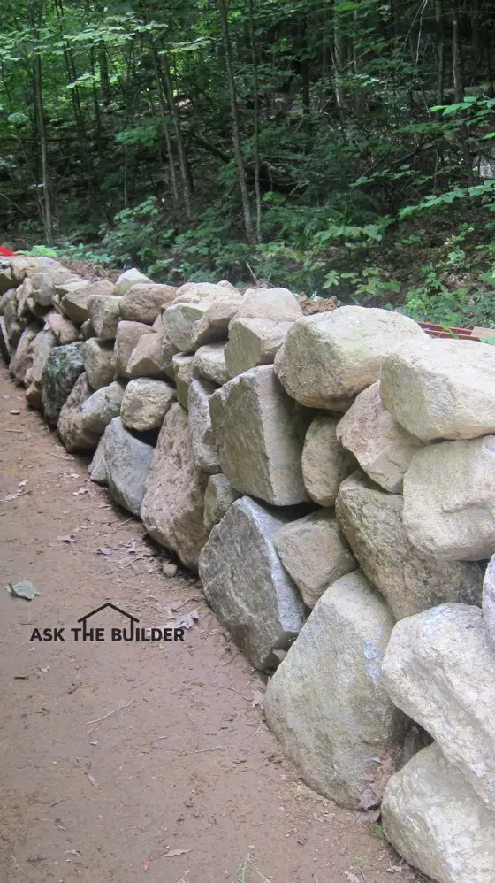 Most of this rock wall was built in less than five hours by one person. Some of the larger rocks had to be put in place with a machine. Photo Credit: Tim Carter