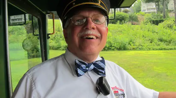 Me wearing my magic bow tie and Conductor's hat. Believe me when I say the tie and hat have powerful magic. Most women boarding the train want a photo of me kissing them on the cheek. Yes, it's a real bow tie I tied.