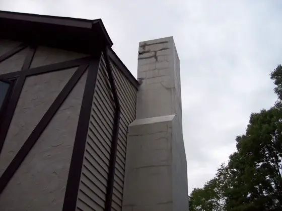 This chimney has some cosmetic cracking and an inferior crown. It can be repaired properly and will last for decades if done right. Photo Credit: John Loughran