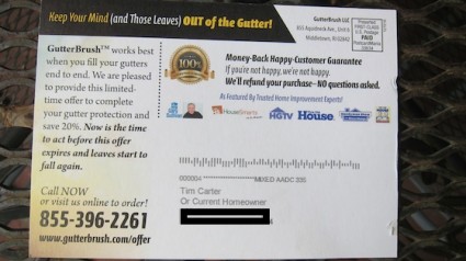 This is the back of the postcard. See the tiny logos above the address field? I blacked out my street and town lines on the card. Believe me, you don't want to meet my guard dog face-to-face. She can run much faster than you and when she pounces on your back, it will be like being hit with a bag of mortar. Photo credit: Tim Carter