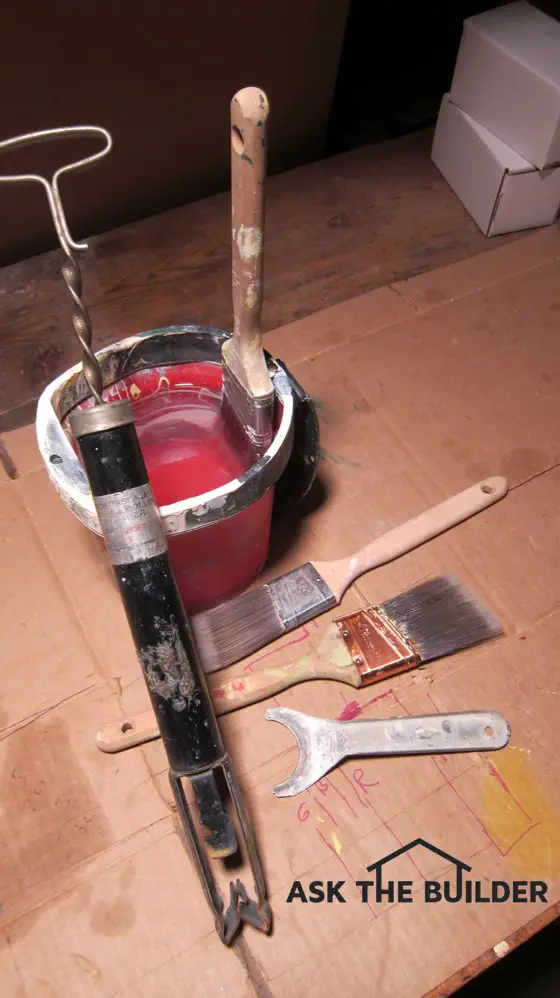 Here are a few tools that make cleaning paint brushes and rollers fast and easy. Photo credit: Tim Carter