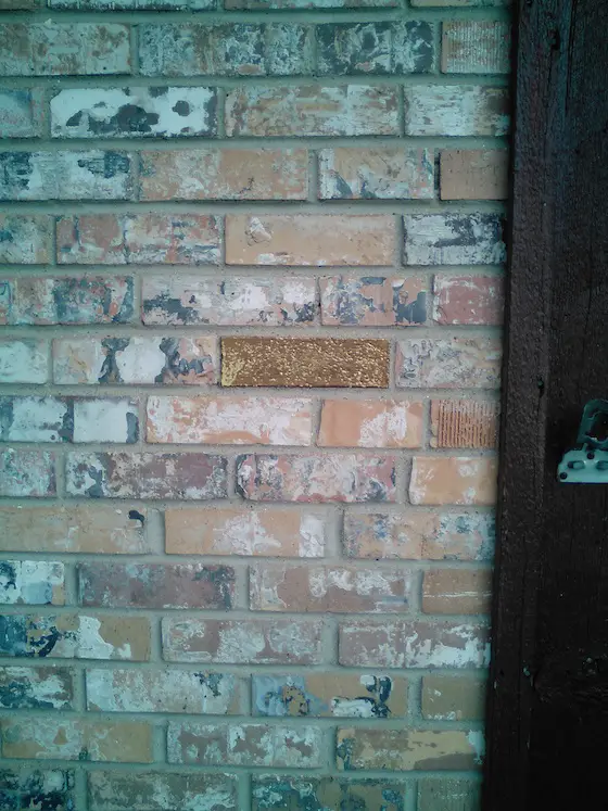 You can clearly see the gold brick. No way this was installed this close to the front door by mistake and in multiple houses. Photo credit: Threasa Brown
