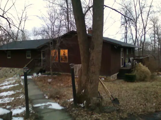 Here's Amy's house. The siding is dark and the sun is low in the sky, so turn on your imagination machine to think about all that's possible! Photo credit: Amy Wring-Her-Hands :-)