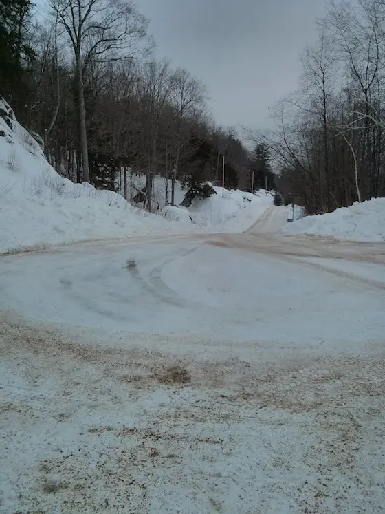 I rotated 90 degrees to the right to take this photo. You're looking north up my street. The snow on the left side of the road is about 6 feet deep as there's a swale along side the roadway. Photo credit: Tim Carter