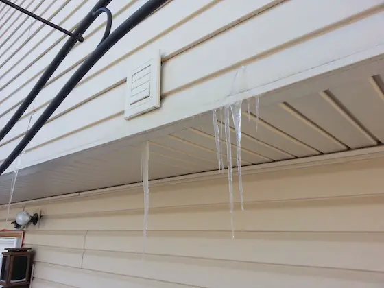 This amount of ice indicates vast amounts of water vapor are seeping behind the siding where it WILL CAUSE rot and mold. Photo credit: Mark Nielson