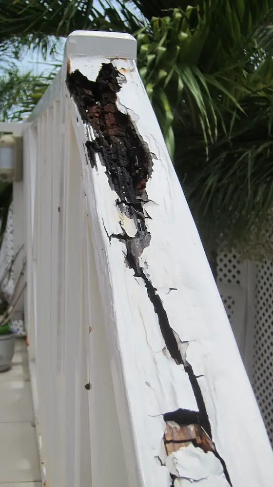 This handrail up a flight of exterior steps is only eight years old. Look at the ROT. Regular nails were used, not stainless steel. Untreated lumber was used for the railing. Photo credit: Tim Carter