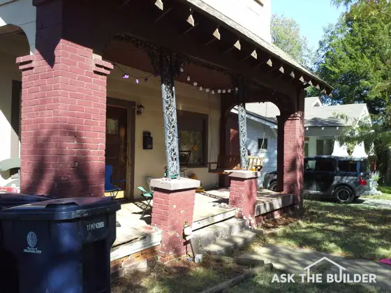 These wrought iron porch columns and brick support piers are out of plumb and must be repaired. Photo Credit: John Hartney