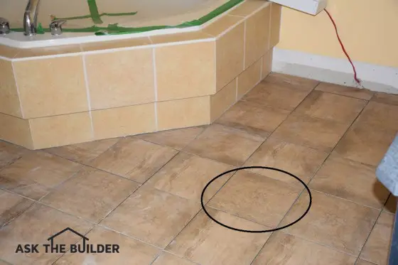 Many of the floor tiles in this photo don’t match the circled one. The homeowner thought they’d all match. Photo Credit: Sandy Mayor