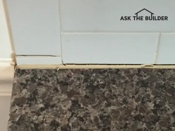 This grout line crack on top of the granite top is quite normal in a new home. Photo Credit: Dave Waters