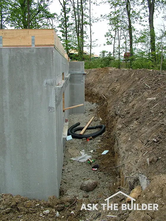 Pouring Concrete Slab Next To House Foundation 