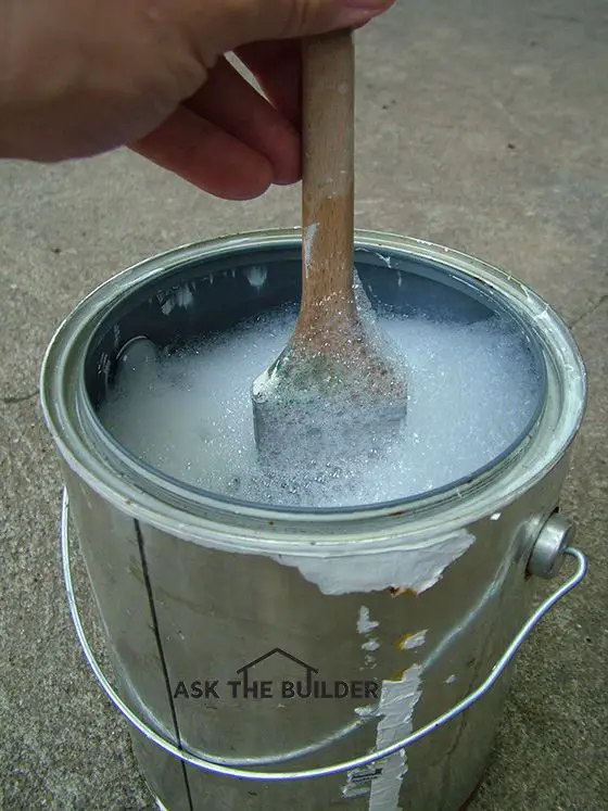 paint brush in paint can