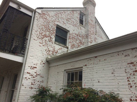 brick home peeling paint