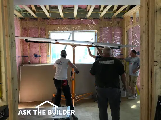 drywall installation using lifting machine