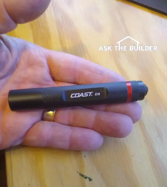 Coast G10 LED Flashlight in hand