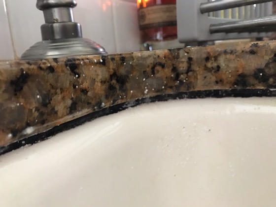 clean undermount sink caulk