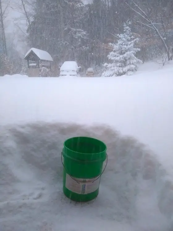 green bucket in snow