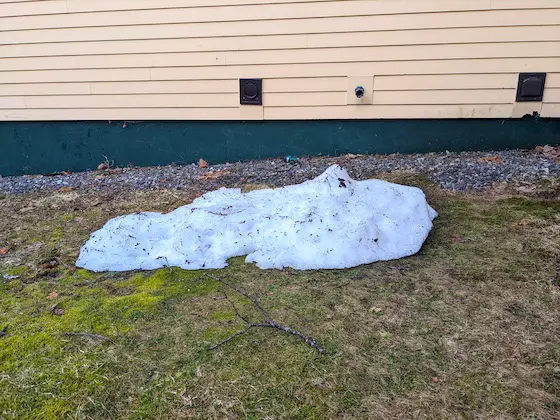 small pile of snow near house