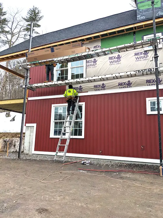 new vinyl siding being installed on a home