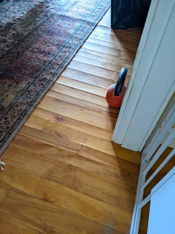 water damaged hardwood floor warped