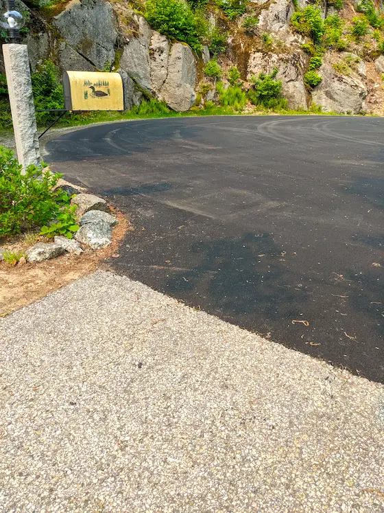 new blacktop paving next to old faded blacktop