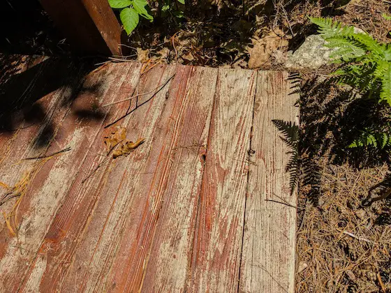cedar decking with a peeling deck sealer
