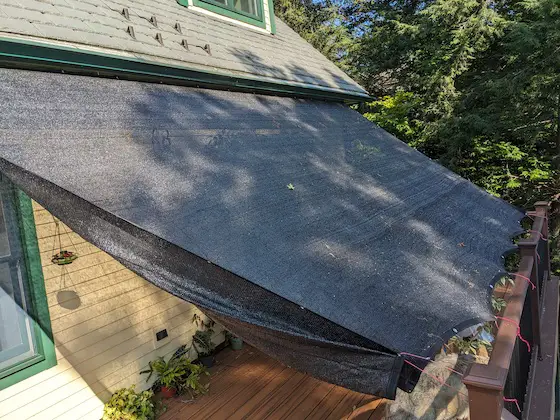 sun filtering tarp on deck blocks 70 percent of the sun