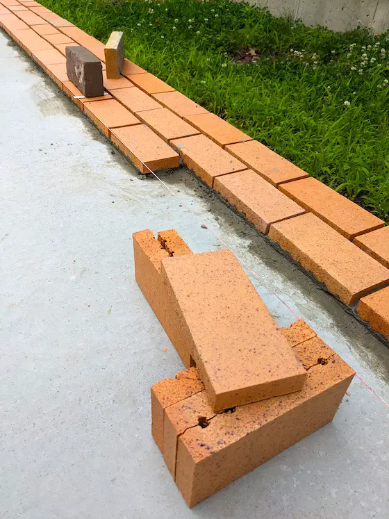 clay paving brick mortared to a concrete slab