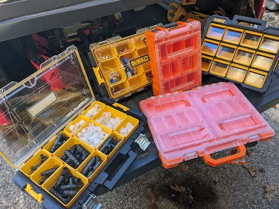 assorted plastic storage boxes for hardware and parts