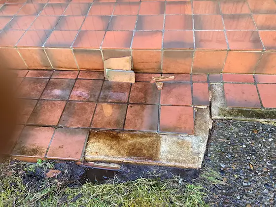 exterior ceramic tile popping off concrete step