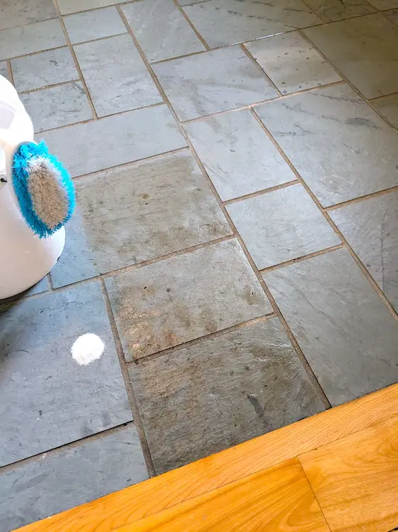 dirty slate flooring next to clean slate using oxygen bleach