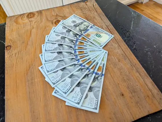ten $100 bills