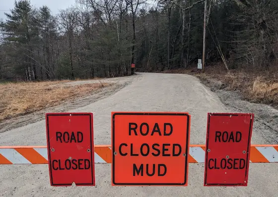 road closed sign mud season