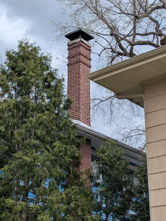 brick chimney with metal cover
