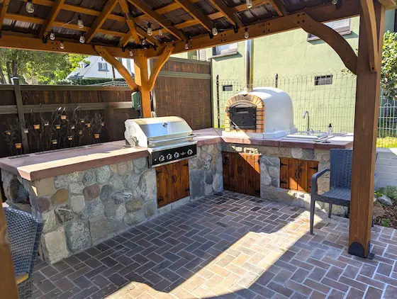 outdoor kitchen under timber frame roof
