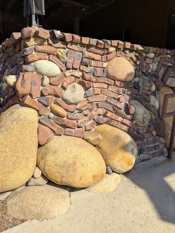 clinker brick wall crooked brick and rock
