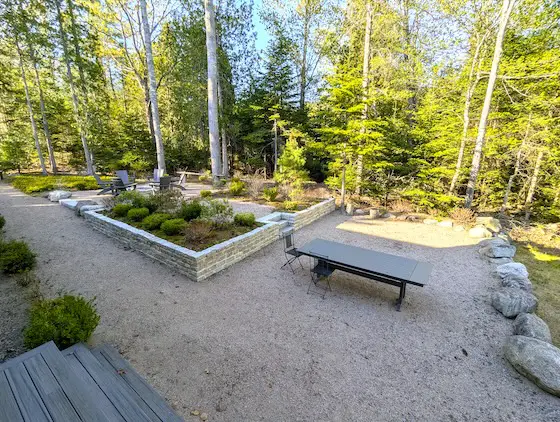 outdoor room ideas fire pit, bushes, granite pathway,