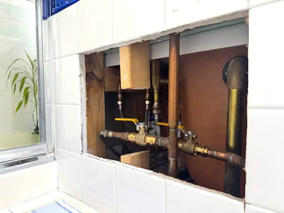 hole in ceramic tile wall copper water lines