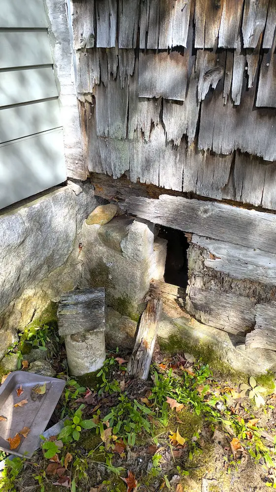 hole in foundation distressed shake siding